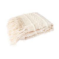 Gefaltete cremefarbene Decke mit Fransen