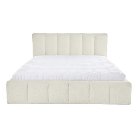 Beiges Bett mit gepolstertem Kopfteil und weißer Matratze, frontal aufgenommen