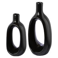 Zwei schwarze, moderne Vasen mit ovalen Öffnungen in der Mitte.