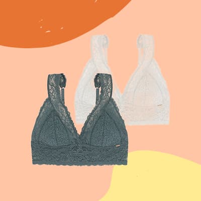 Zwei Spitzen-Bralettes in Dunkelgrün und Weiß vor pastellfarbenem Hintergrund