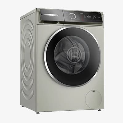 Silberne Waschmaschine mit runden Mustern an der Seite und einem digitalen Bedienfeld oben rechts