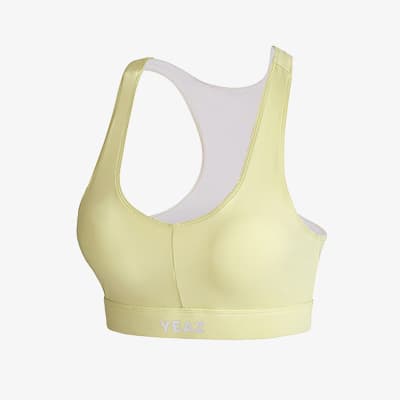 Hellgelber Sport-BH mit breiten Trägern und Racerback, von hinten schräg gezeigt, Marke YEAZ am Unterbrustband